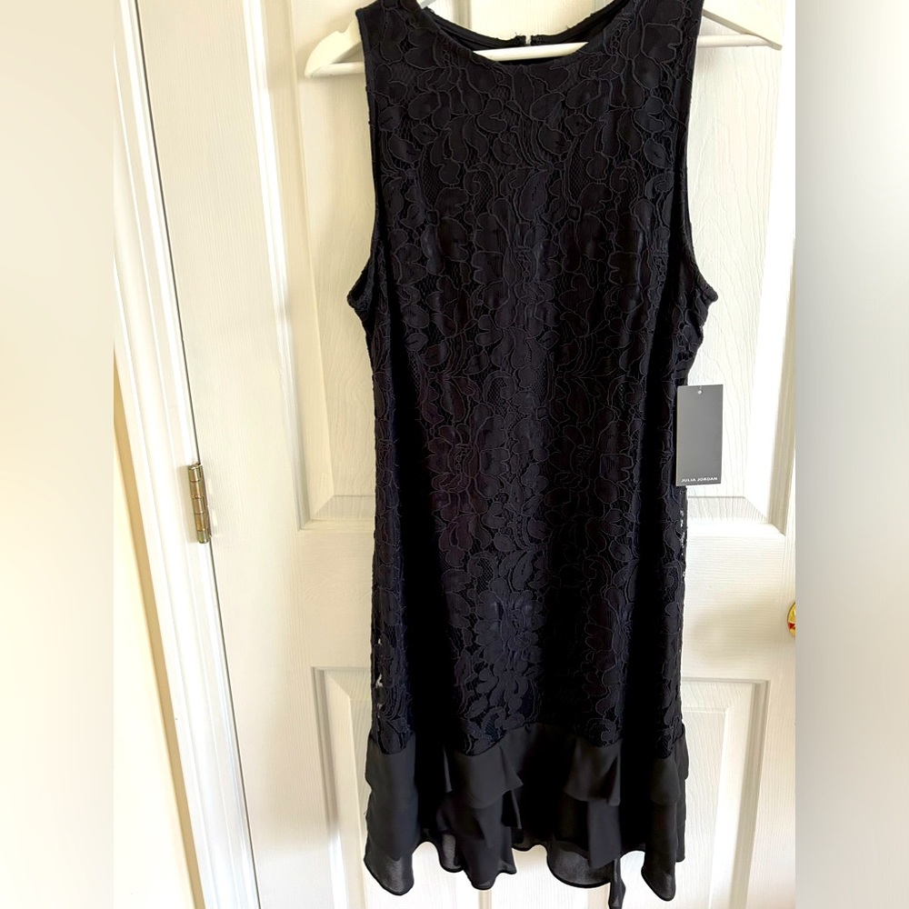 Black lace sleeveless dress with chiffon ruffle bottom.